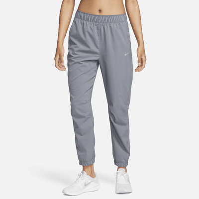 Pantaloni da running da riscaldamento a 7/8 a vita media Nike Dri-FIT Fast – Donna