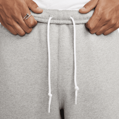 Pants de tejido Fleece con dobladillo abierto para hombre Nike Solo Swoosh