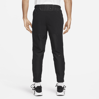 Nike APS Men's Dri-FIT ADV Woven Versatile Trousers. Nike CA