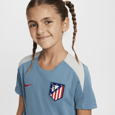 Atlético Madrid Strike Nike Dri-FIT Kurzarm-Fußballoberteil aus Strickmaterial für ältere Kinder