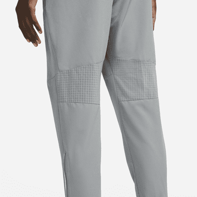 Pantaloni da running in tessuto Dri-FIT Nike Phenom – Uomo