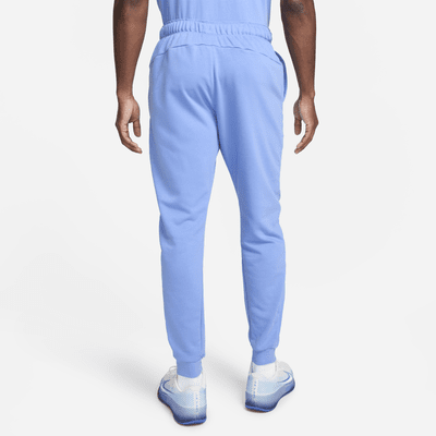 NikeCourt Heritage Men's French Terry Tennis Trousers. Nike IE