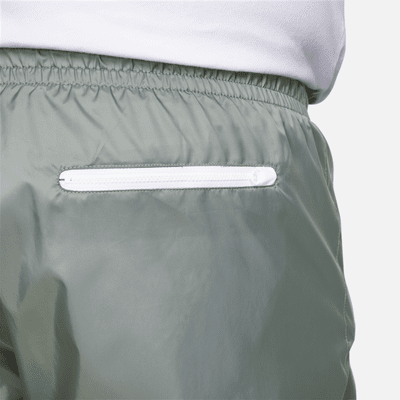 Pantalon doublé en tissu tissé Nike Windrunner pour homme