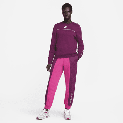 Pantalones de tejido Fleece de tiro medio para mujer Nike Sportswear Icon Clash