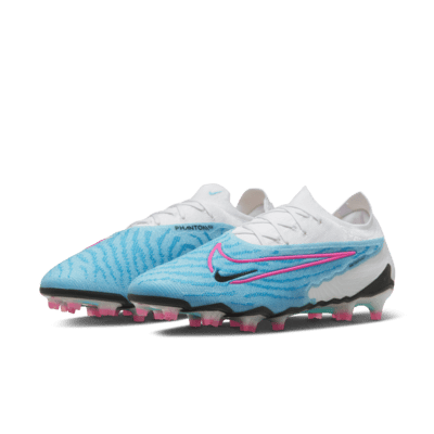 Tacos de fútbol de corte low para terreno firme Nike Phantom GX Elite