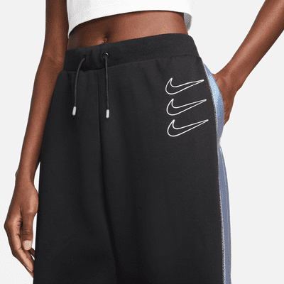 Pantalones de entrenamiento de tejido Fleece con gráficos para mujer Nike Sportswear