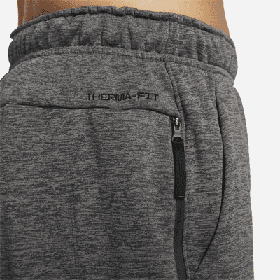 Pants de fitness con dobladillo abierto Therma-FIT para hombre Nike Therma