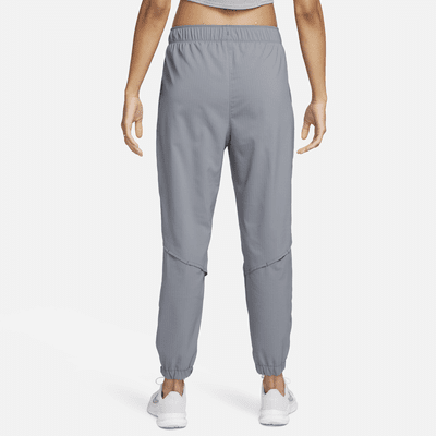 Pantaloni da running da riscaldamento a 7/8 a vita media Nike Dri-FIT Fast – Donna