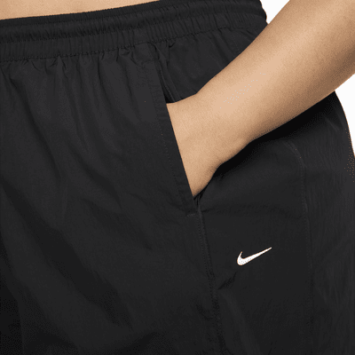 Pants con dobladillo abierto de tejido Woven de tiro alto para mujer Nike Windrunner (talla grande)