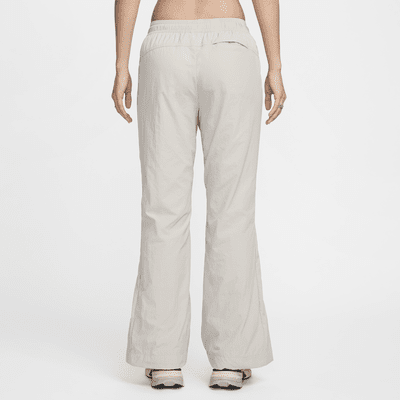 Pantalon à zip taille mi-haute déperlant Nike Sportswear Collection pour femme