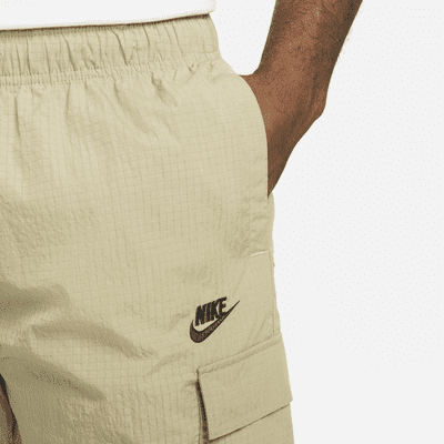 Konserveringsmiddel Transistor Forbandet Vævede, lette Nike Sportswear Repeat-bukser til mænd. Nike DK