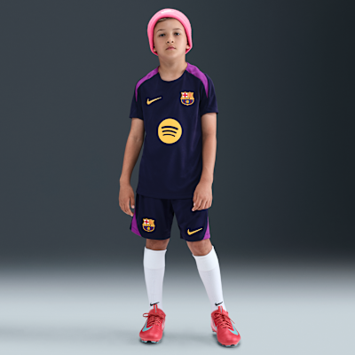 Maglia da calcio a manica corta Nike Dri-FIT FC Barcelona Strike – Ragazzo/a