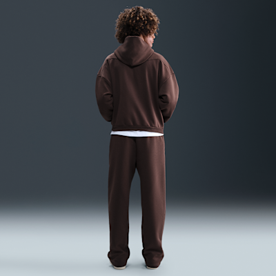 Męskie spodnie do koszykówki ze szczotkowanej dzianiny z luźnymi nogawkami Therma-FIT Nike Standard Issue