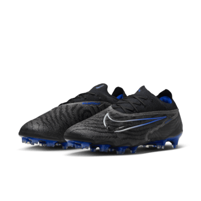 Tacos de fútbol de corte low para terreno firme Nike Phantom GX Elite