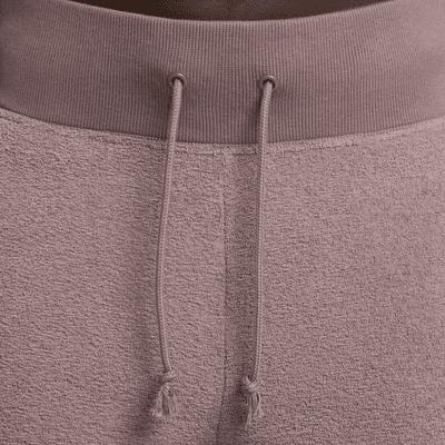 Pantaloni confortevoli in fleece a gamba larga e vita alta Nike Sportswear Phoenix Plush – Donna