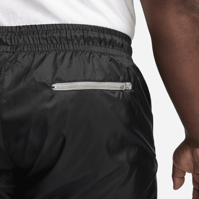 Calças entrançadas com forro Nike Windrunner para homem