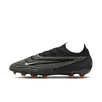 Tacos de fútbol de corte low para terreno firme Nike Phantom GX Elite