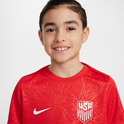 Playera de fútbol de manga corta Nike Dri-FIT para antes del partido para niños talla grande USMNT Academy Pro