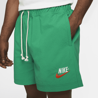 green and orange nike shorts