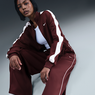Pants de entrenamiento de tiro medio y pierna amplia para mujer Nike Sportswear