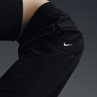 Nike Windrunner Pantalón de talle alto y tejido Woven con dobladillo abierto - Mujer