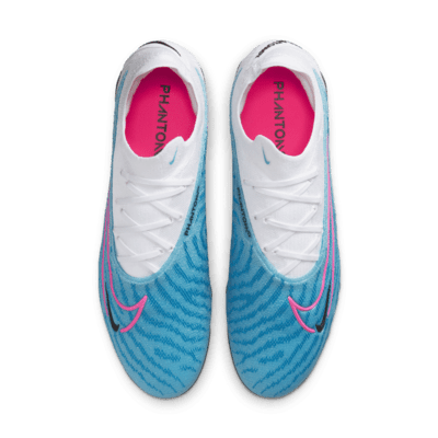 Tacos de fútbol de corte low para terreno firme Nike Phantom GX Elite