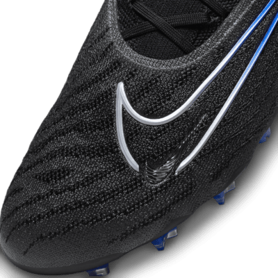 Tacos de fútbol de corte low para terreno firme Nike Phantom GX Elite