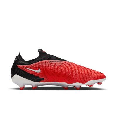 Tacos de fútbol de corte low para terreno firme Nike Phantom GX Elite