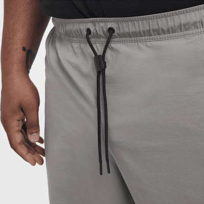 Pantaloni in tessuto Nike Tech – Uomo