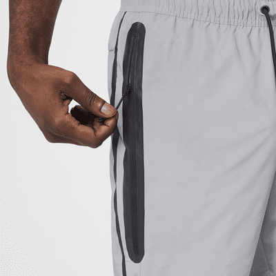 Nike Tech Pantalons de teixit Woven amb disseny reflector - Home