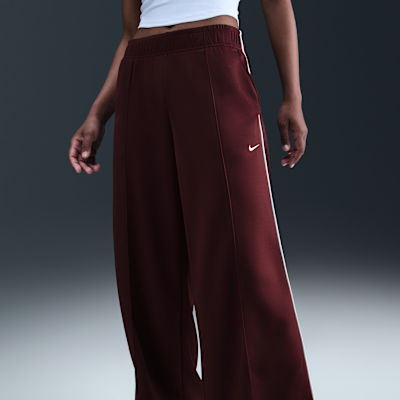 Pants de entrenamiento de tiro medio y pierna amplia para mujer Nike Sportswear