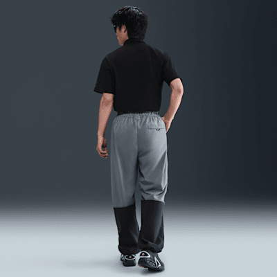 กางเกงขายาวทรงเปิดชายแบบทอผู้ชาย Nike Tech