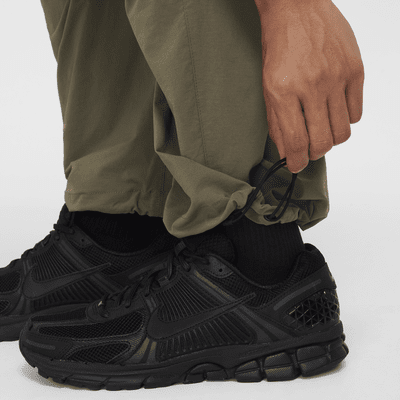 กางเกงขายาวทรงเปิดชายแบบทอผู้ชาย Nike Tech