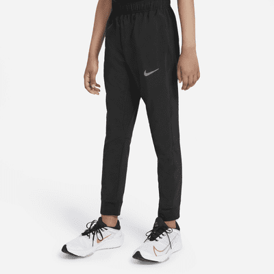 Nike Dri-FIT-træningsbukser i vævet materiale til (drenge). Nike DK