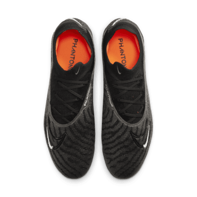 Tacos de fútbol de corte low para terreno firme Nike Phantom GX Elite