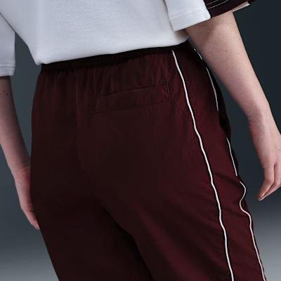 Vävda byxor Nike Windrunner med hög midja och vida fållar för kvinnor
