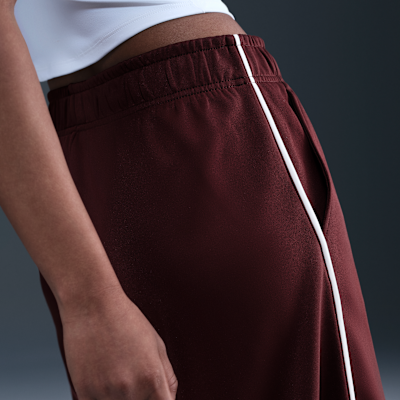 Pants de entrenamiento de tiro medio y pierna amplia para mujer Nike Sportswear