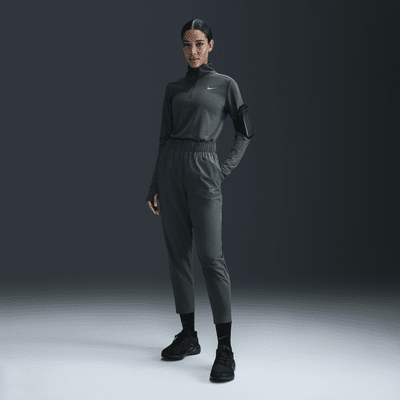 Nike Dri-FIT Fast-løbebukser i 7/8 længde med mellemhøj talje til kvinder