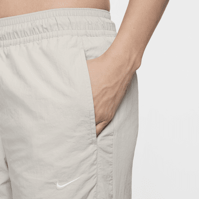 Pantalon à zip taille mi-haute déperlant Nike Sportswear Collection pour femme