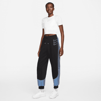 Pantalones de entrenamiento de tejido Fleece con gráficos para mujer Nike Sportswear