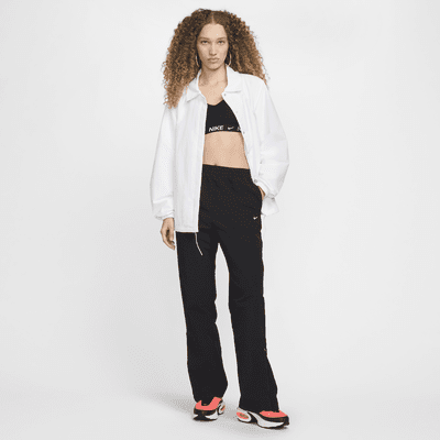 Pantaloni a vita alta in tessuto UV con orlo aperto e zip Nike Sportswear Essential – Donna