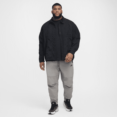 Pantaloni in tessuto Nike Tech – Uomo