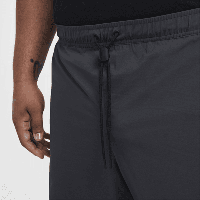 Pantaloni in tessuto Nike Tech – Uomo