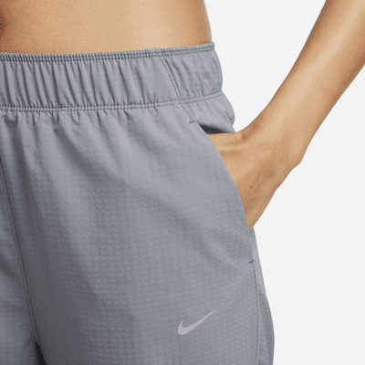 Pantaloni da running da riscaldamento a 7/8 a vita media Nike Dri-FIT Fast – Donna