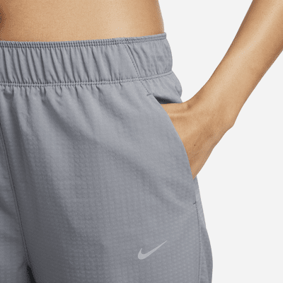 Nike Dri-FIT Fast Women's Mid-Rise 7/8 Warm-Up Running Trousers. Nike RO
