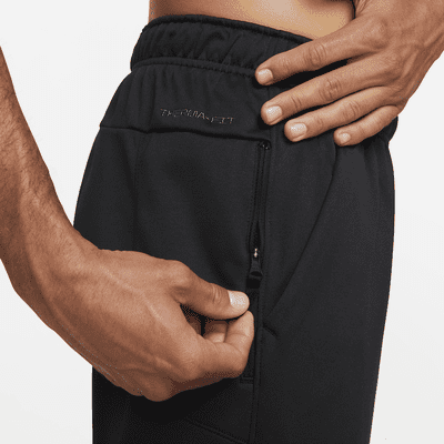 Pants de fitness con dobladillo abierto Therma-FIT para hombre Nike Therma