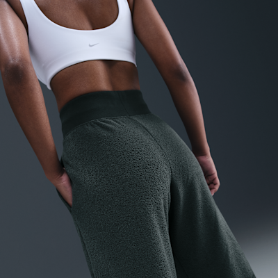 Pants de tejido Fleece cálidos de piernas anchas y tiro alto para mujer Nike Sportswear Phoenix Plush