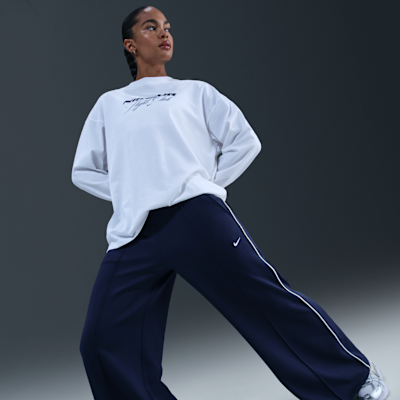 Pants de entrenamiento de tiro medio y pierna amplia para mujer Nike Sportswear
