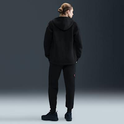 Dámské flísové kalhoty Nike Football Total 90 Paris Saint-Germain Tech se středně vysokým pasem