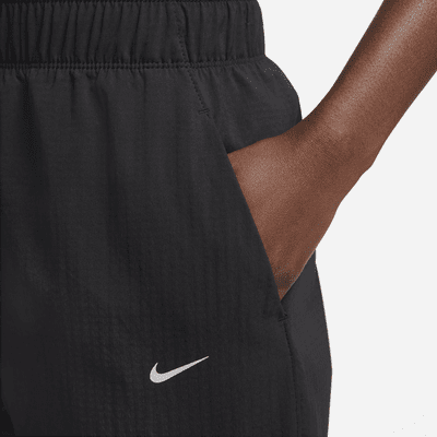 Pantaloni da running da riscaldamento a 7/8 a vita media Nike Dri-FIT Fast – Donna